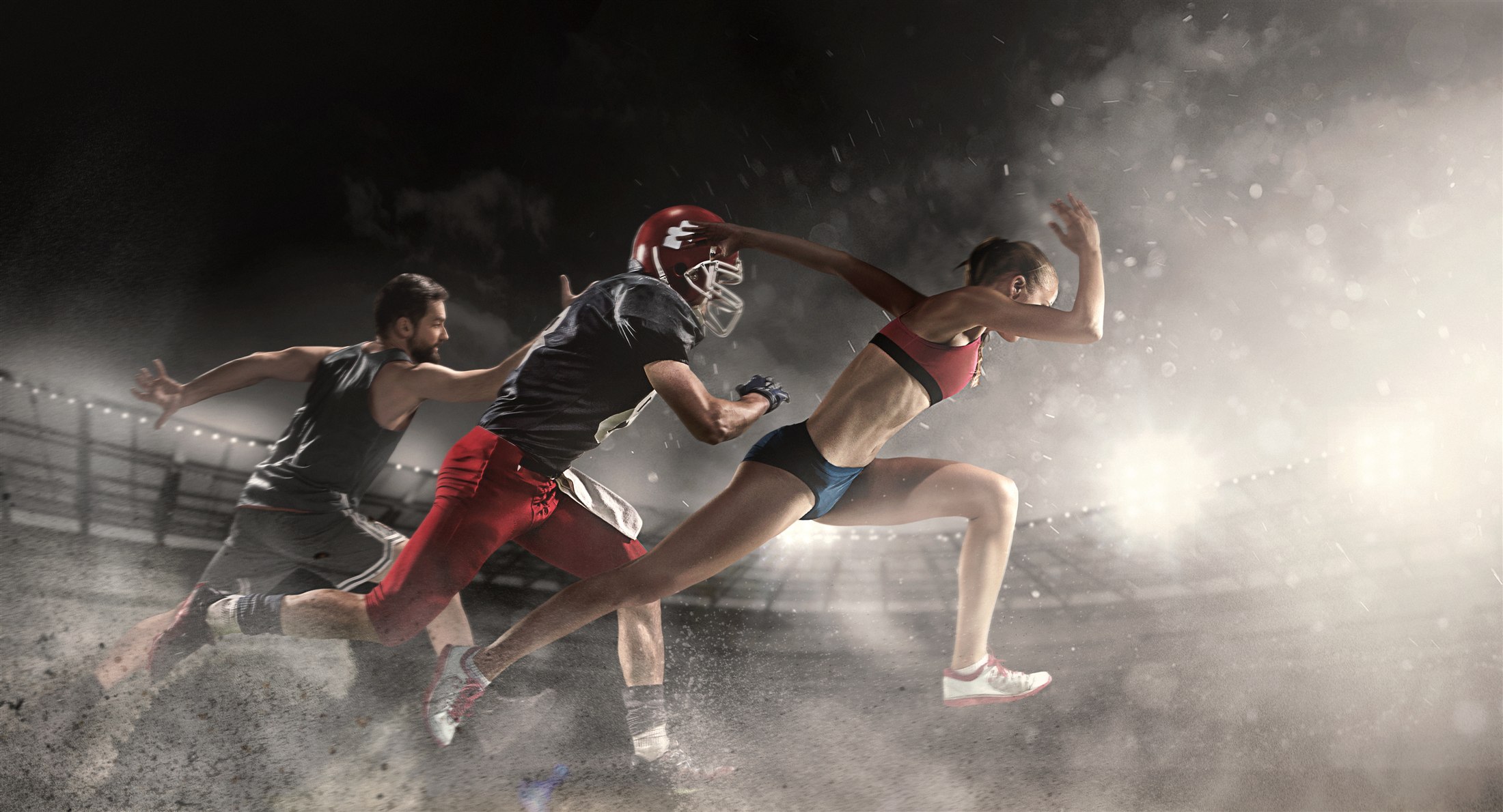 Athletes sprinting through a high-intensity stadium training session